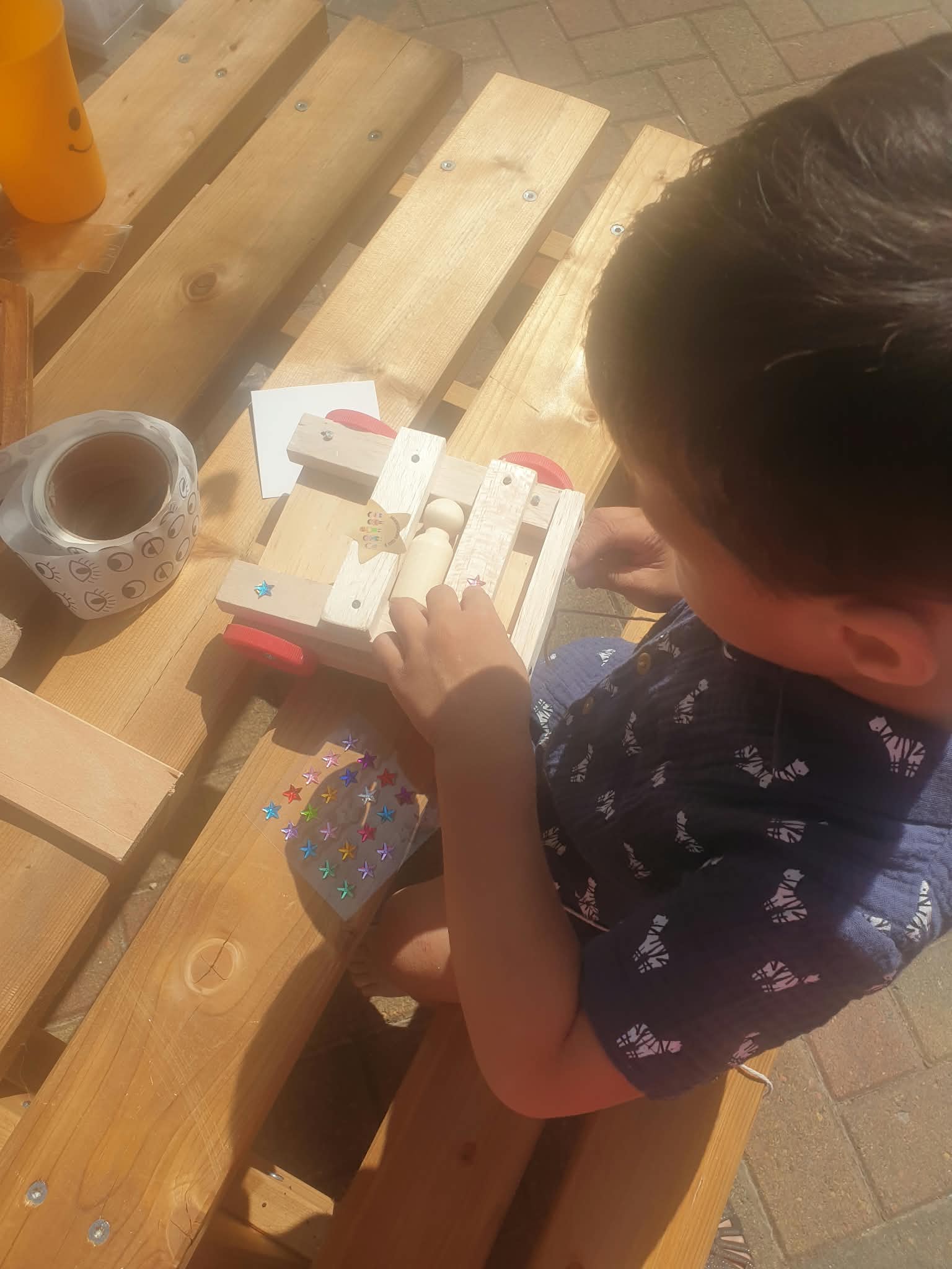 Wooden animals, figures and vehicles made by the children