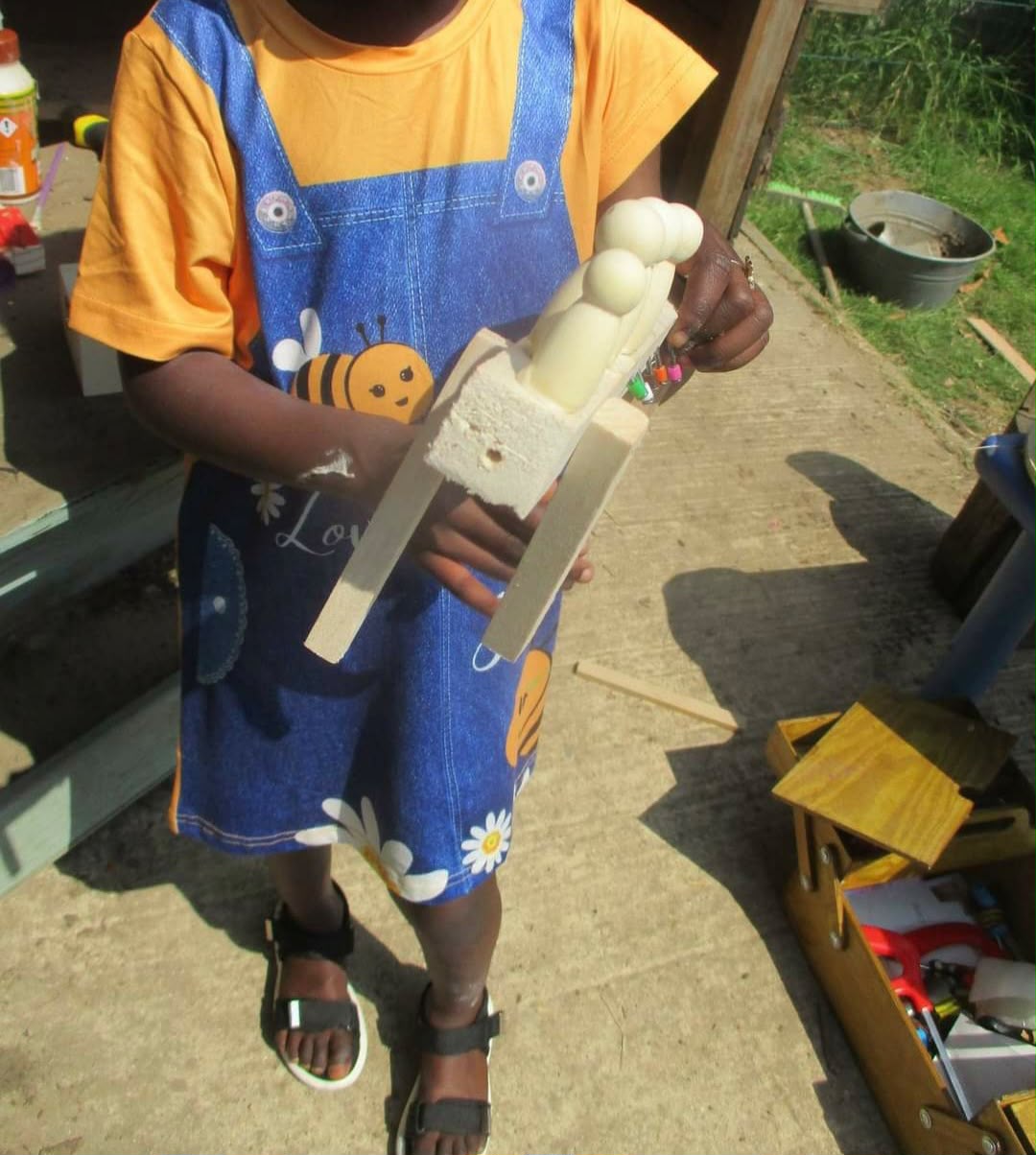 A child at the woodwork bench