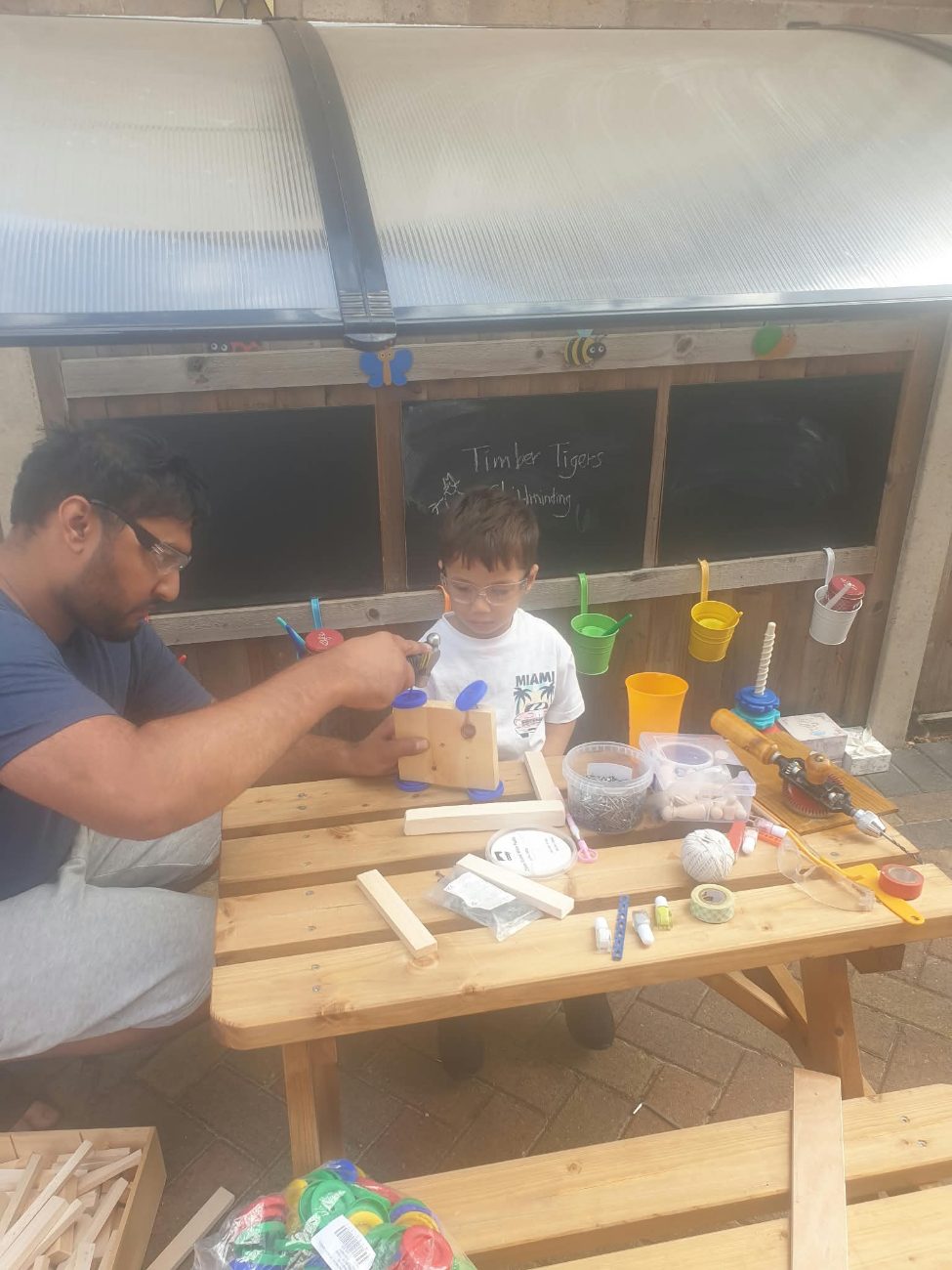 A child at the woodwork bench